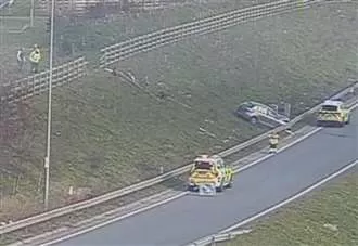 Man taken to hospital after car plunges down embankment