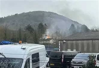 Fire crews fight blaze with thick smoke clouding over area
