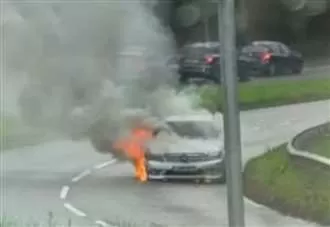 Firefighters called after car blaze on busy road