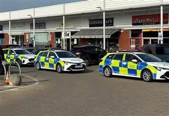 Woman arrested after officers descend on shopping parade