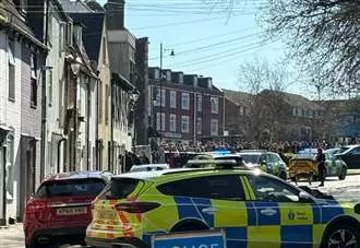 Crowd cheers as armed police make arrest following stabbing