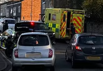 Car and moped collide near busy road