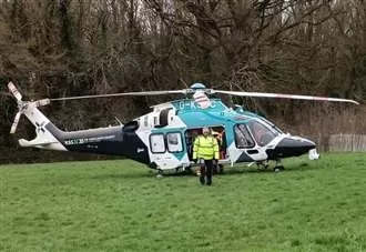Air ambulance lands near woodland